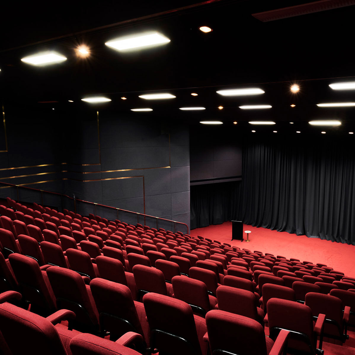 Rows of empty chairs in a theatre